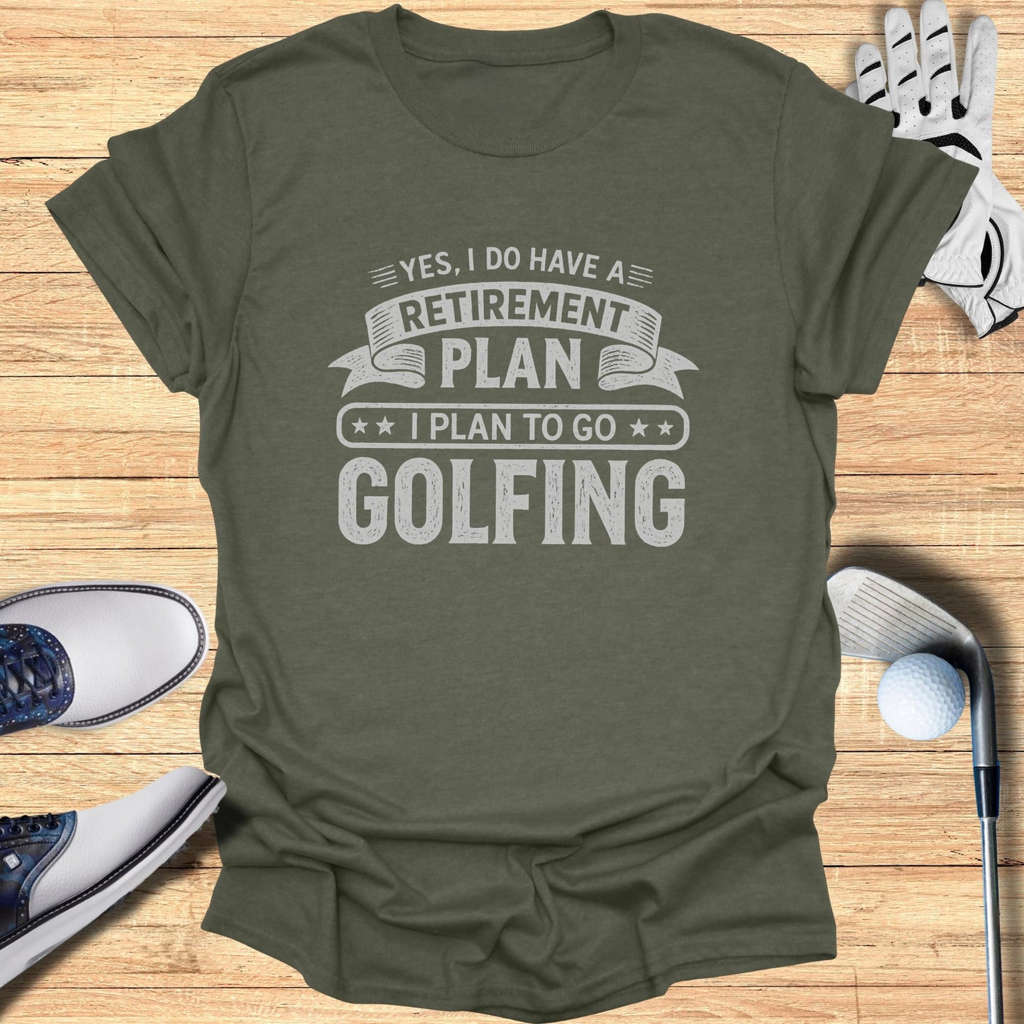 Green t-shirt with text: "YES, I DO HAVE A RETIREMENT PLAN I PLAN TO GO GOLFING".
