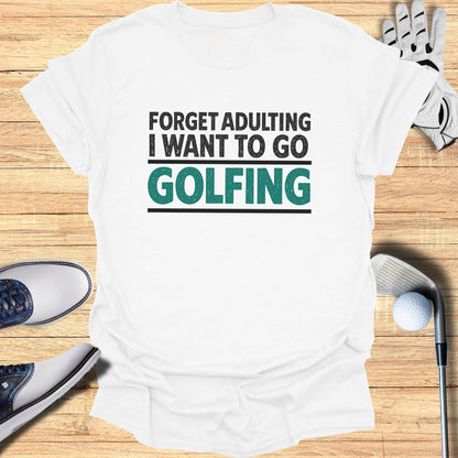 White t-shirt with "Forget Adulting I Want To Go Golfing" text in black and teal.
