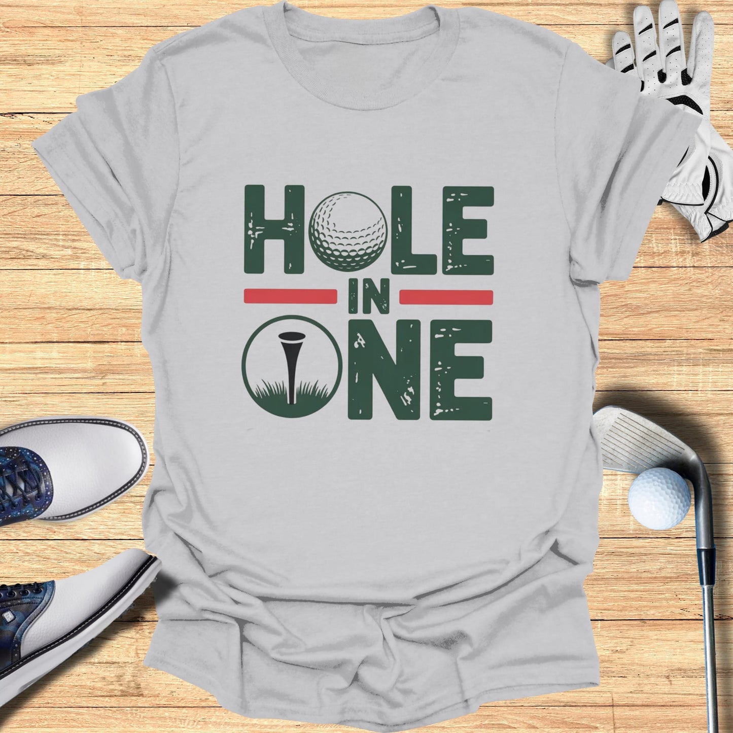 Gray t-shirt with "Hole In One" text and golf ball graphic.