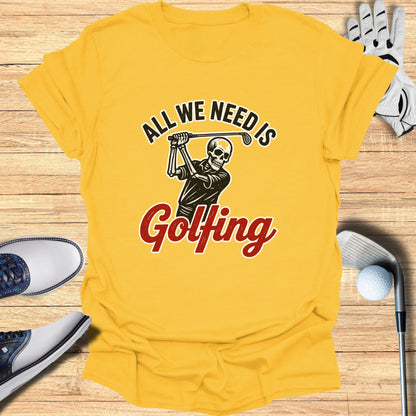 Yellow t-shirt with graphic of skeleton golfing, text "ALL WE NEED IS Golfing".