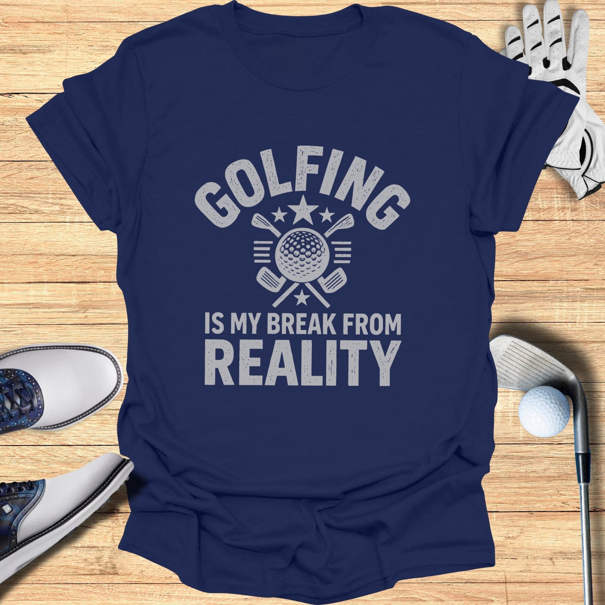 Navy t-shirt with "GOLFING IS MY REALITY" graphic and golf equipment.