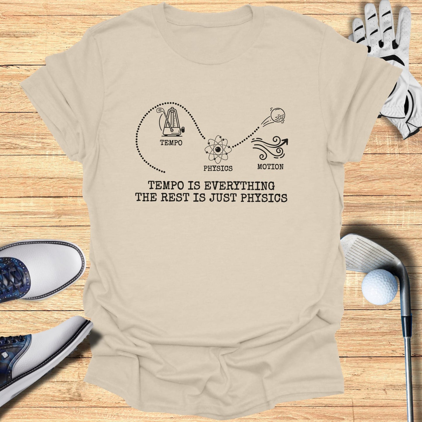 T-shirt with golf accessories, featuring "TEMPO IS EVERYTHING THE REST IS JUST PHYSICS" text.