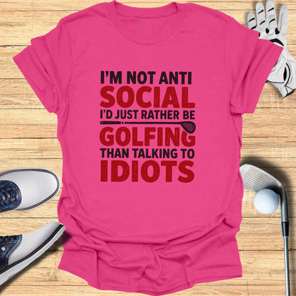 Pink t-shirt with "I'm not anti social, I'd rather be golfing than talking to idiots" text.