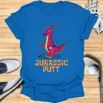 Cartoon dinosaur in golf attire with "JURASSIC PUTT" text.