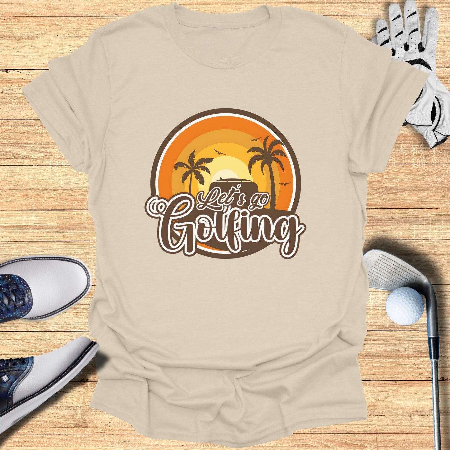 T-shirt with "Let's Go Golfing" text and tropical golf scene.