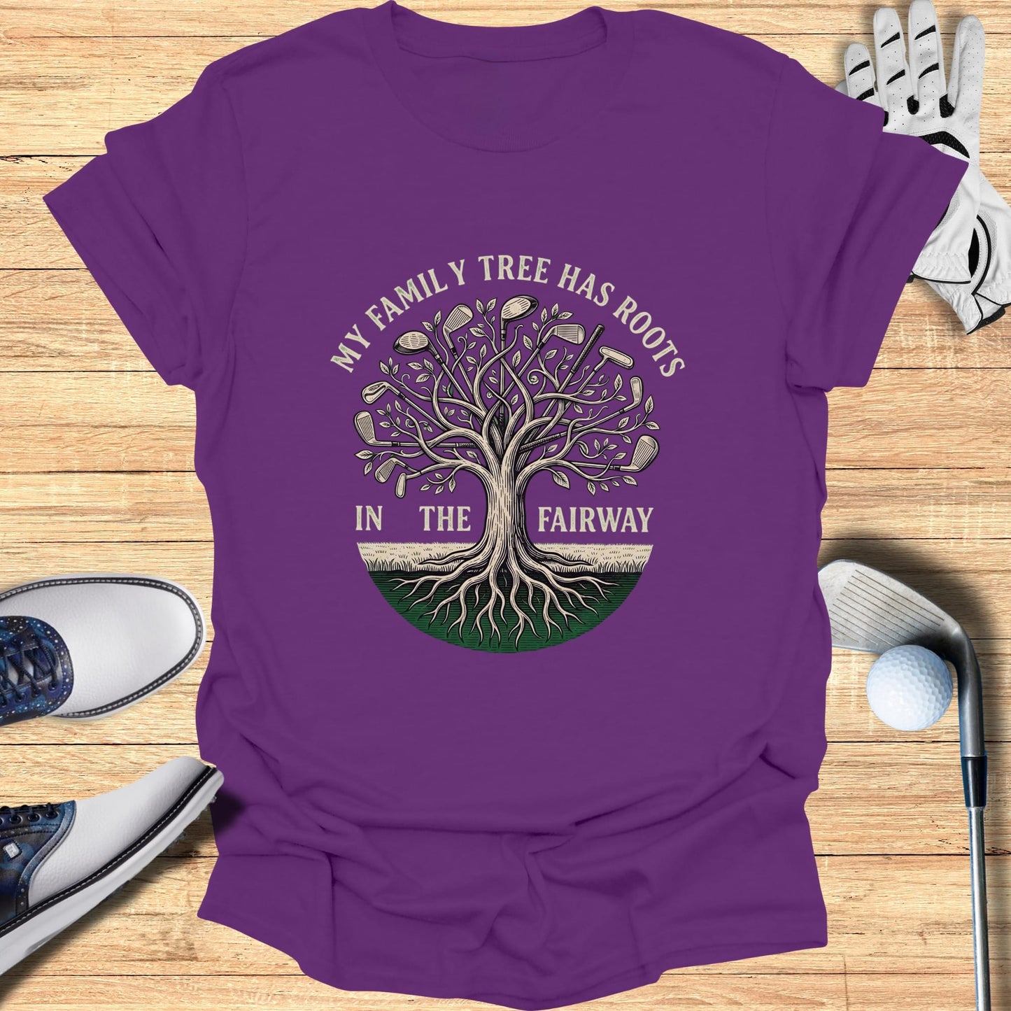 Purple t-shirt with "My Family Tree Has Roots In The Fairway" and golf club tree design.