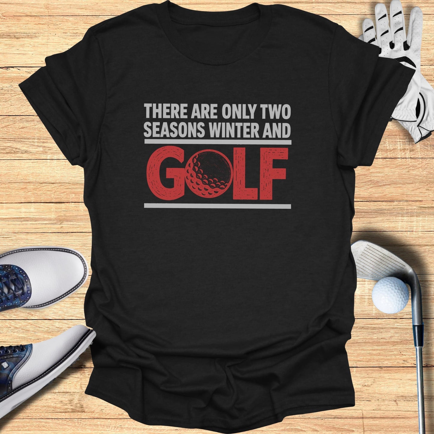 Black t-shirt with "There are only two seasons, winter and golf" text and golf ball graphic.
