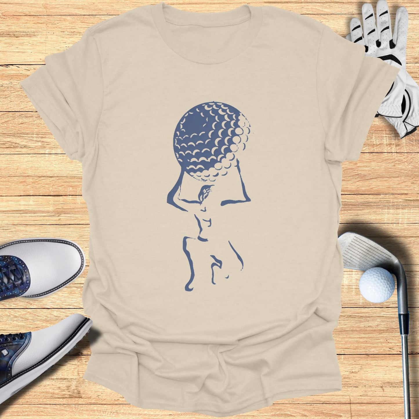 T-shirt with a minimalist blue golf ball and abstract golfer graphic.