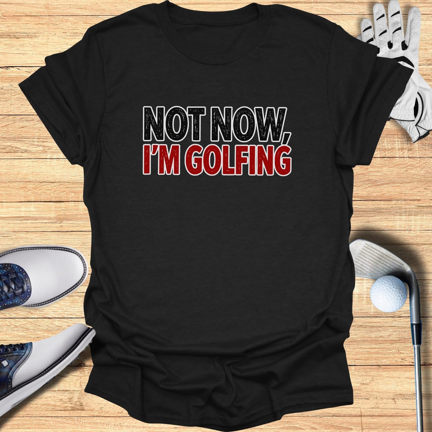 Black t-shirt with "NOT NOW, I'M GOLFING" text in white and red.