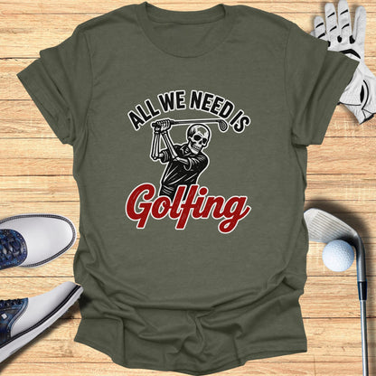 Olive green t-shirt with skeleton golfer graphic and text "ALL WE NEED IS Golfing".