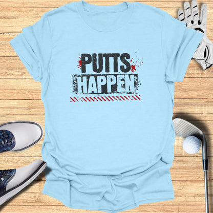 Light blue t-shirt with "PUTTS HAPPEN" text and golf accessories.