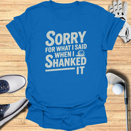 Blue t-shirt with white text reading "Sorry when I shanked it."
