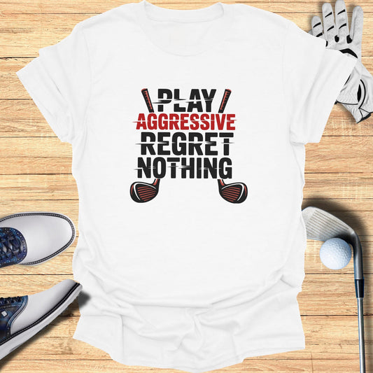 White t-shirt with "PLAY AGGRESSIVE REGRET NOTHING" text and crossed golf clubs.