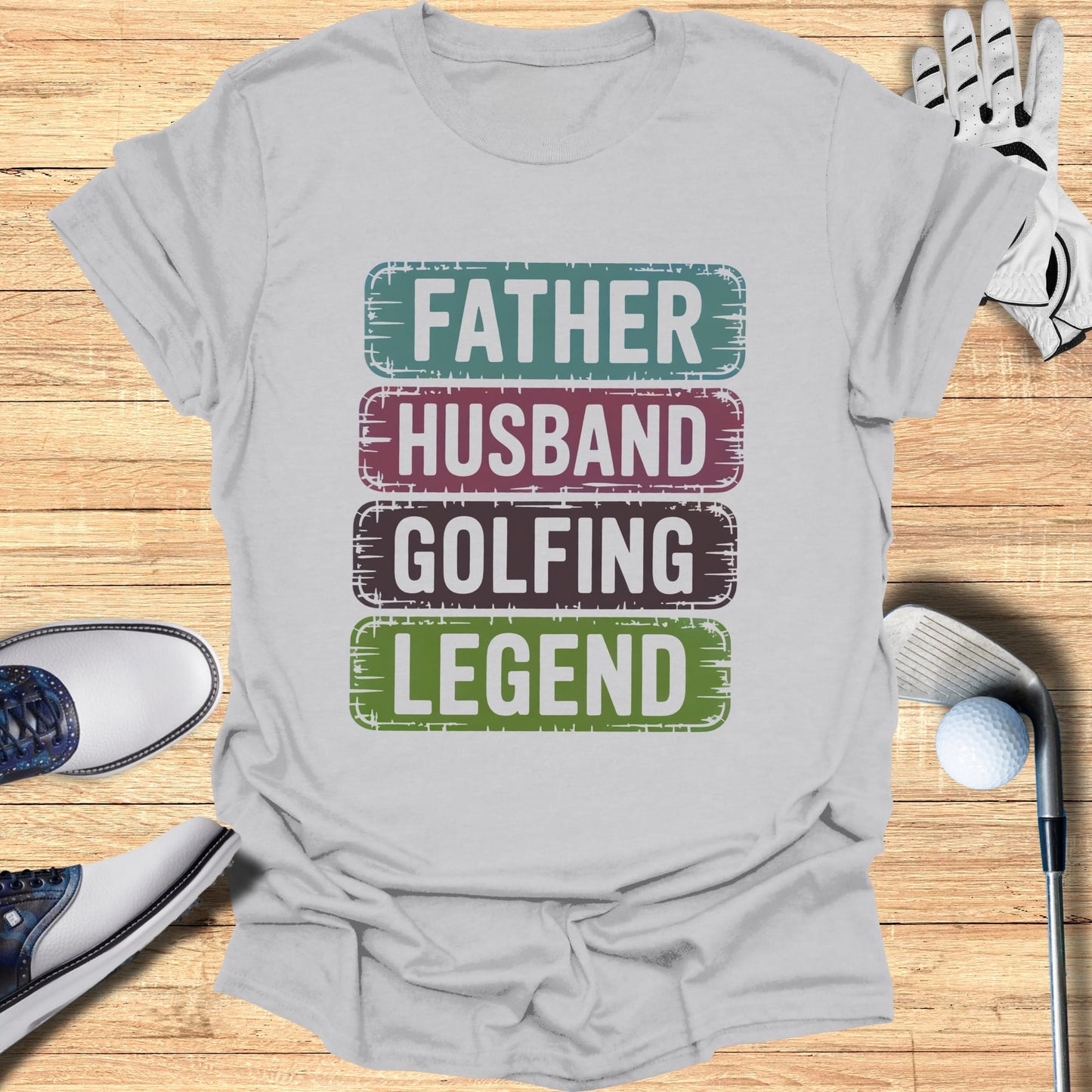 Gray t-shirt with "Father Husband Golfing Legend" text in colorful horizontal bars.