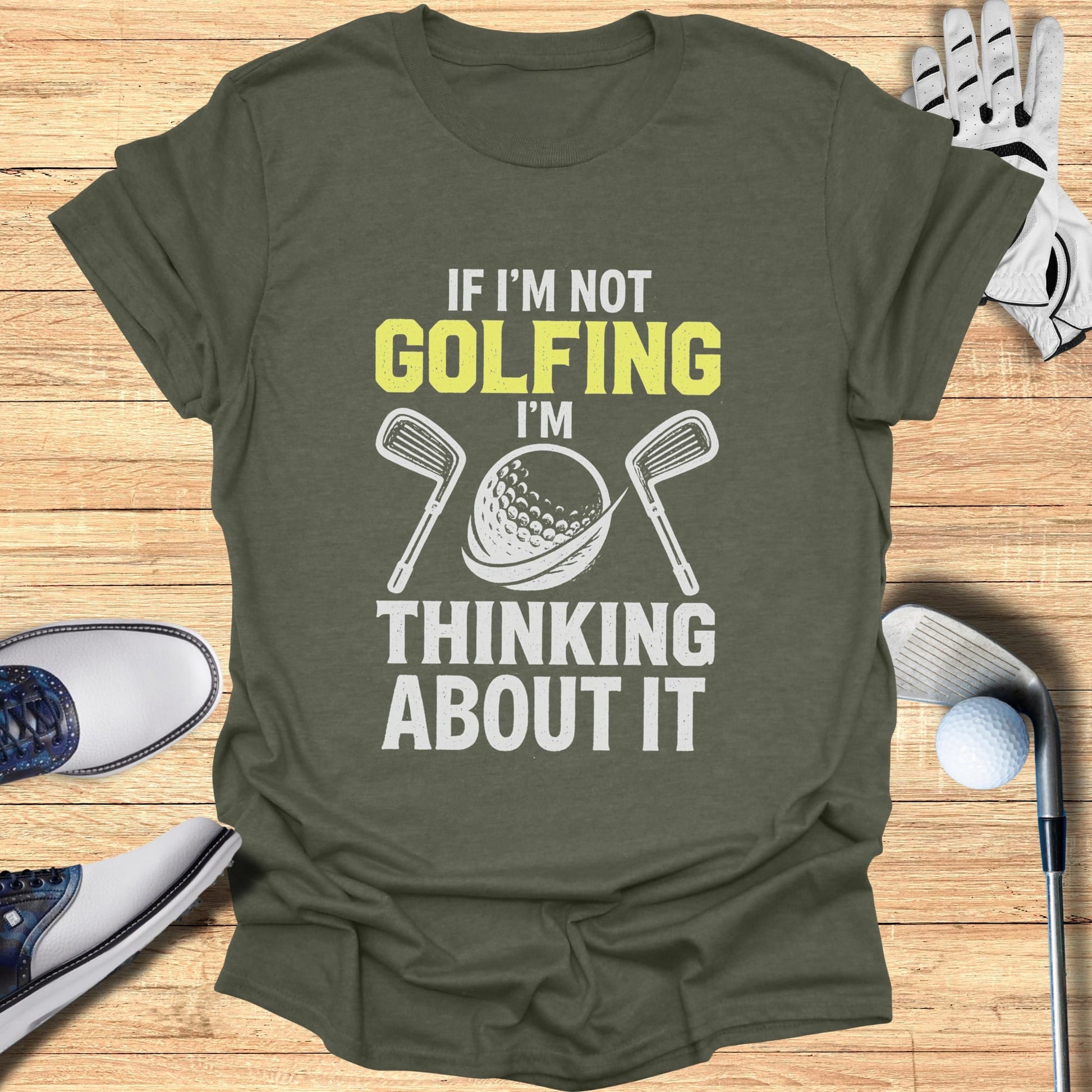 T-shirt with "If I'm not golfing, I'm thinking about it" text and golf imagery.