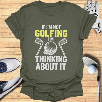 T-shirt with "If I'm not golfing, I'm thinking about it" text and golf imagery.