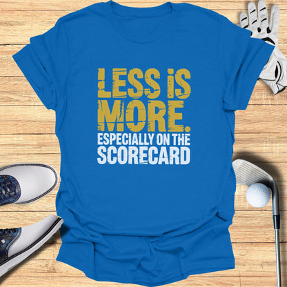 Blue t-shirt with "LESS IS MORE ESPECIALLY ON THE SCORECARD" text.