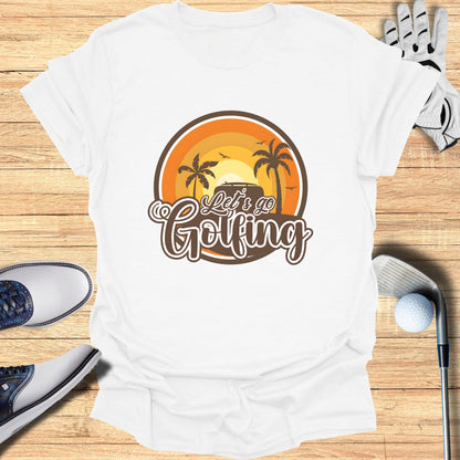 White t-shirt with "Let's Go Golfing" text and a sunset graphic.