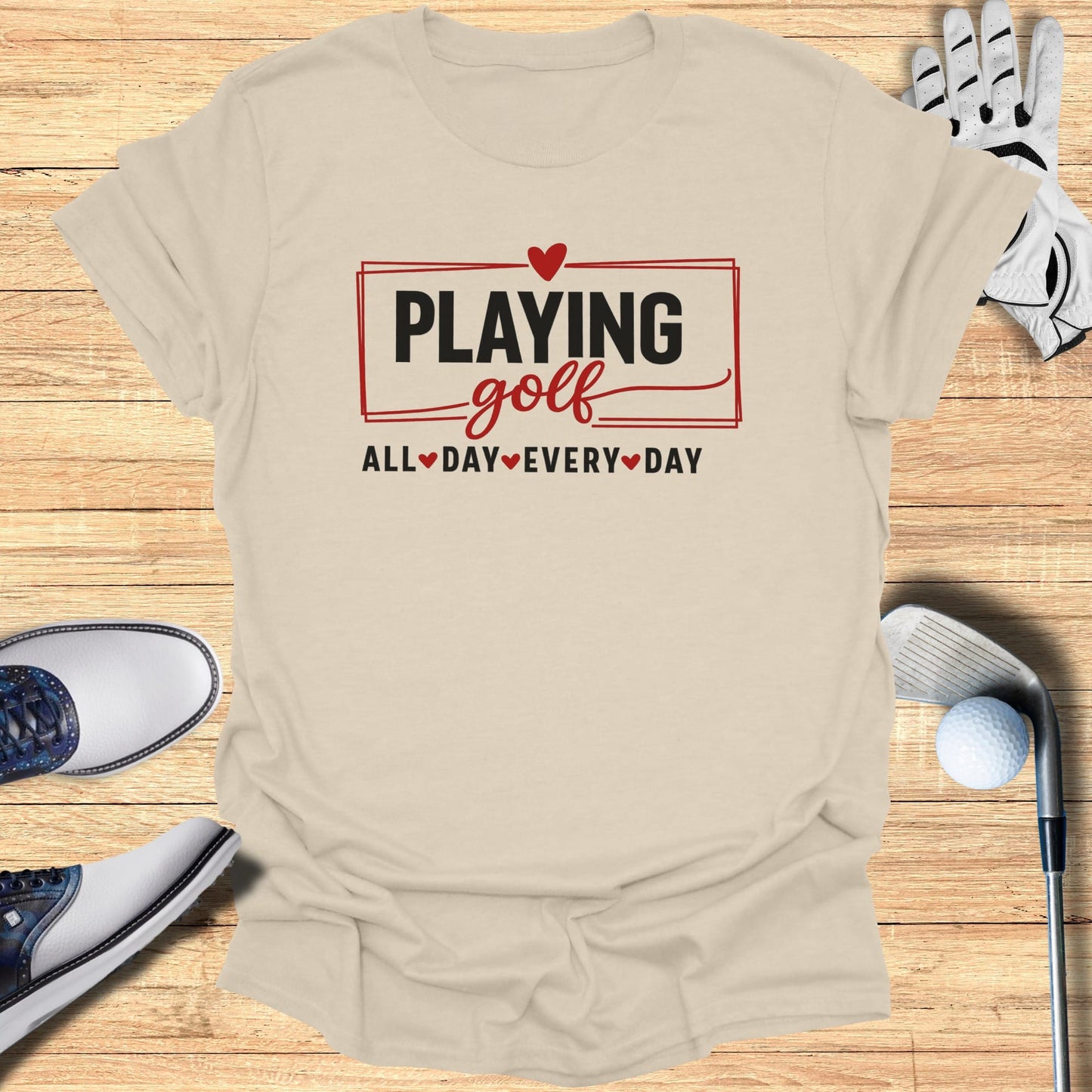 T-shirt with "Playing Golf All Day Every Day" text and golf accessories.