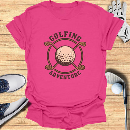 Pink t-shirt with "Golfing Adventure" text and crossed golf clubs and ball graphic.