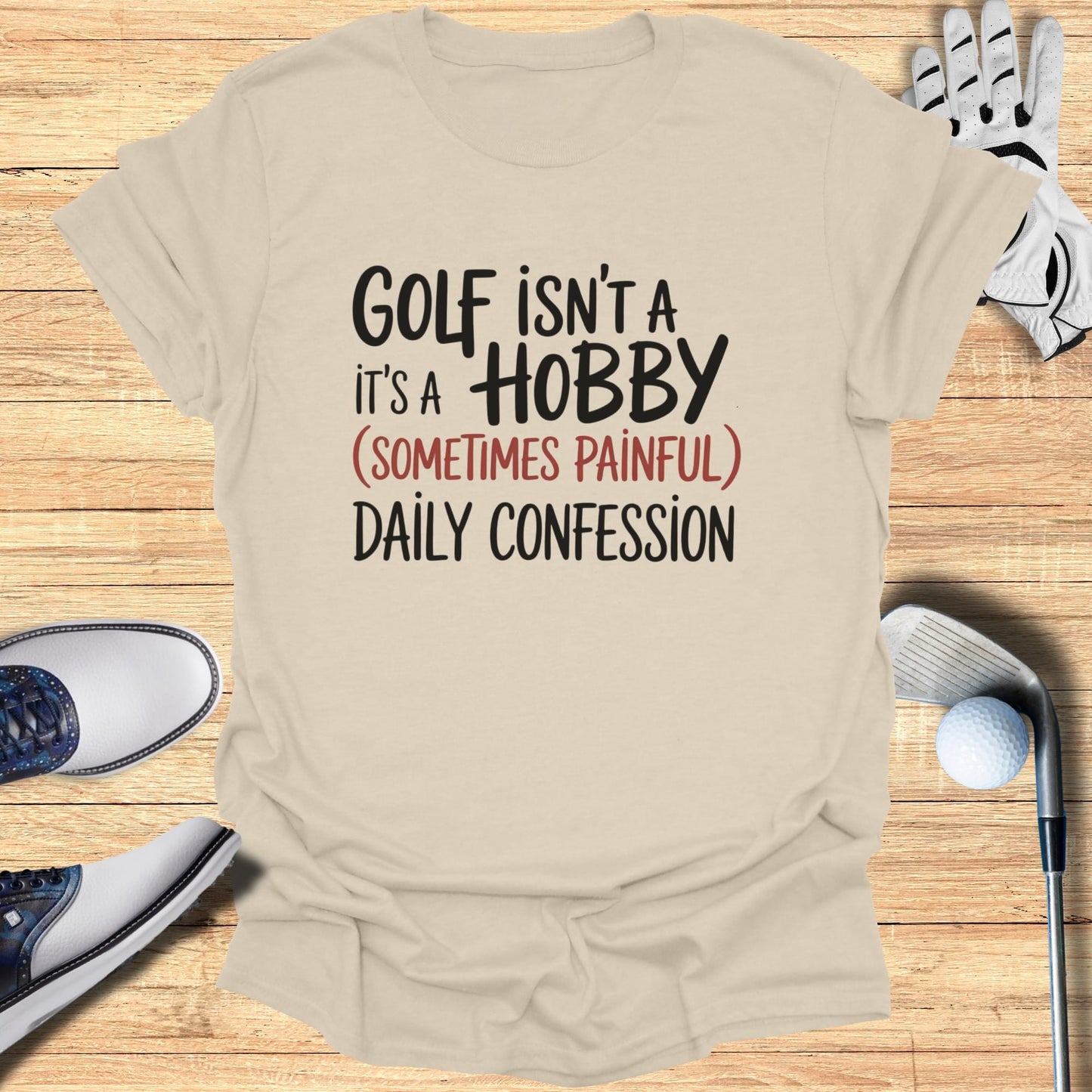 T-shirt with text "Golf isn't a hobby, it's a (sometimes painful) daily confession."