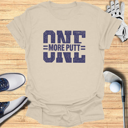 Beige t-shirt with "ONE MORE PUTT" in blue block lettering.