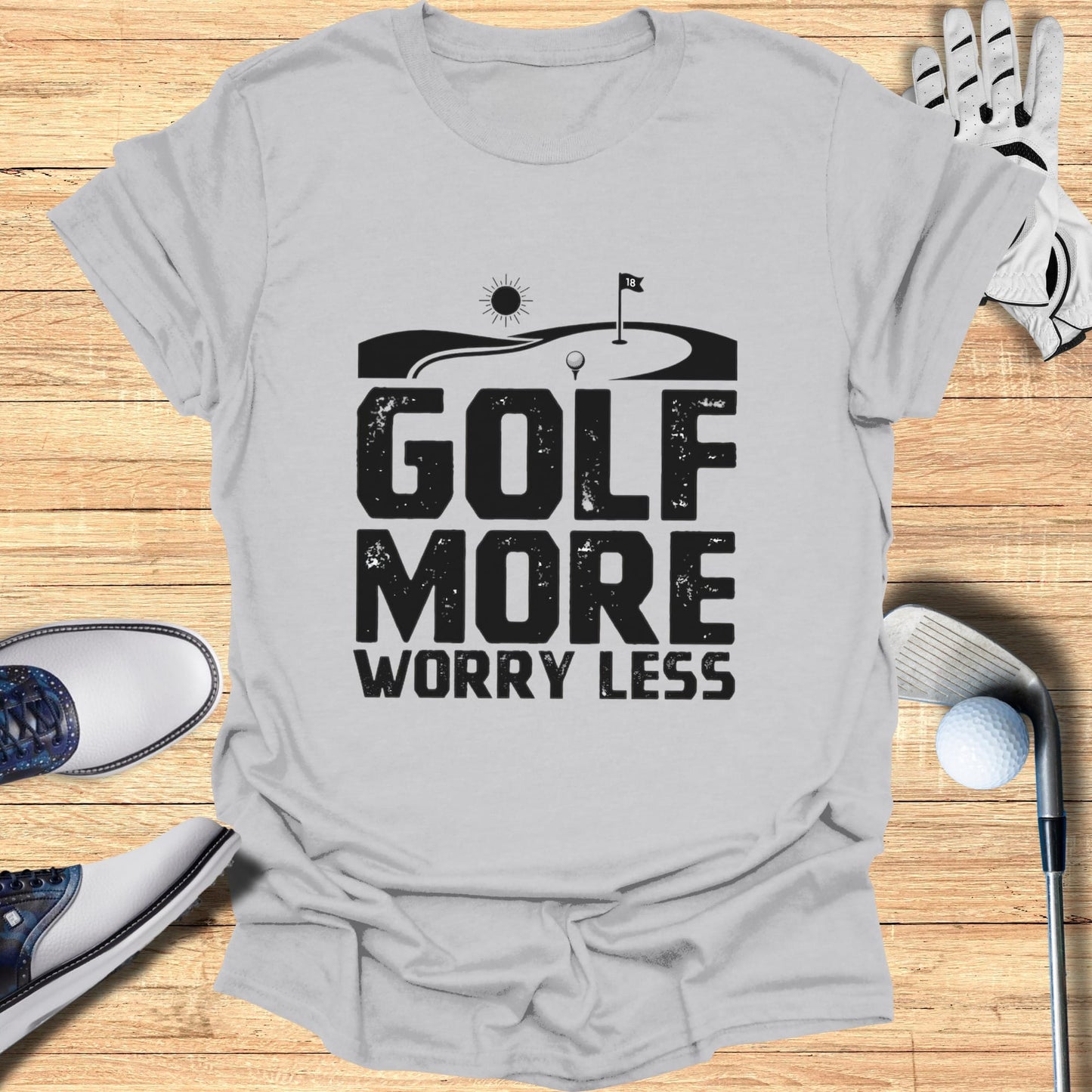 Gray t-shirt with "GOLF MORE WORRY LESS" text and golf imagery.