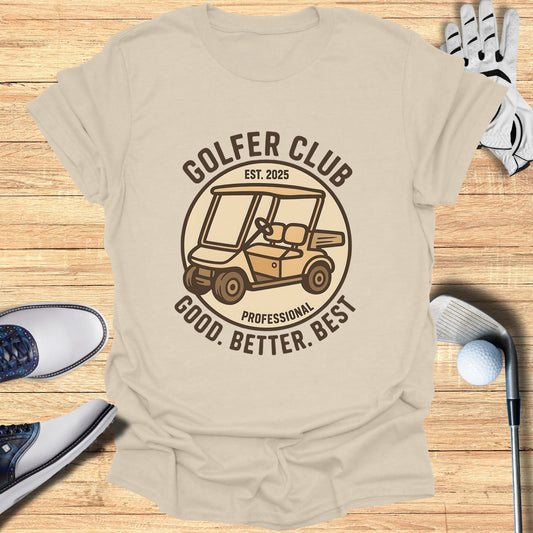 Golf cart and "Golfer Club" text on a beige t-shirt with golf equipment.