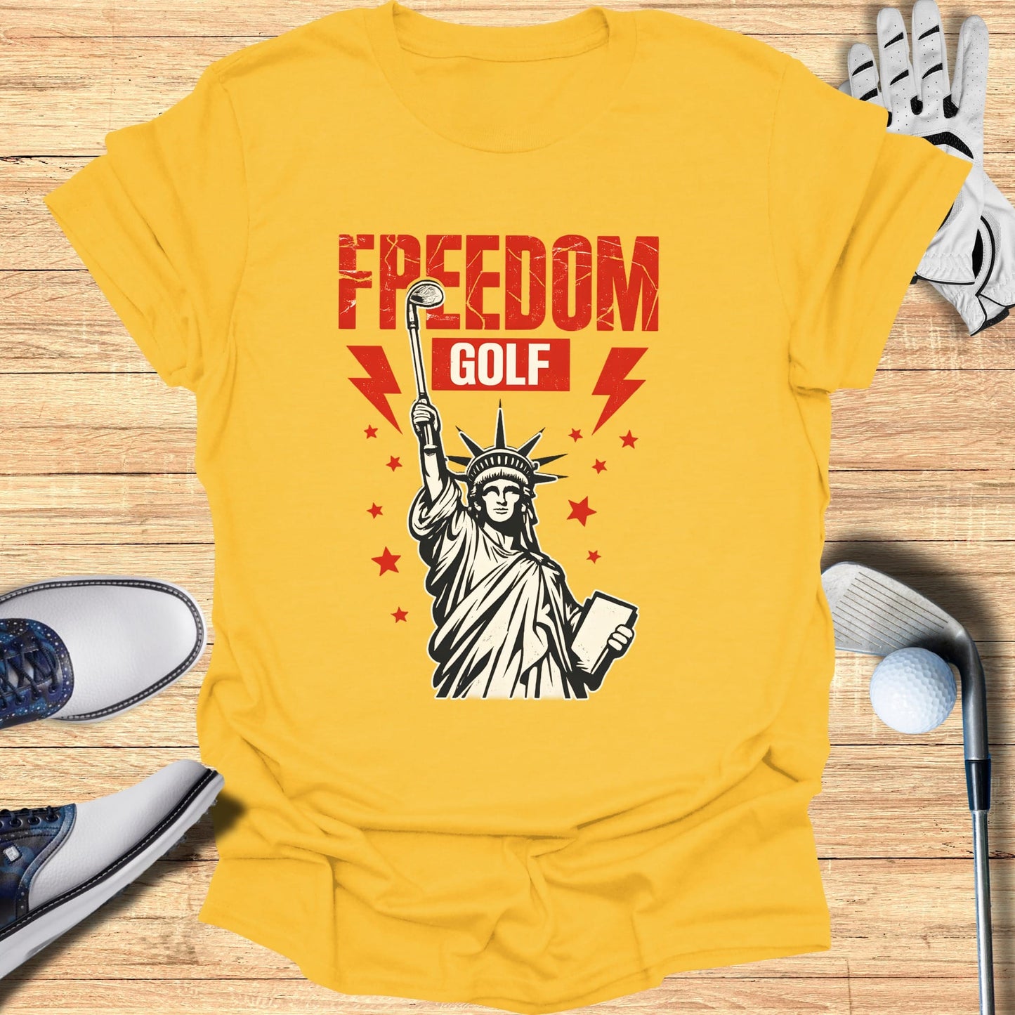 Yellow t-shirt with Statue of Liberty graphic and "FREEDOM GOLF" text.
