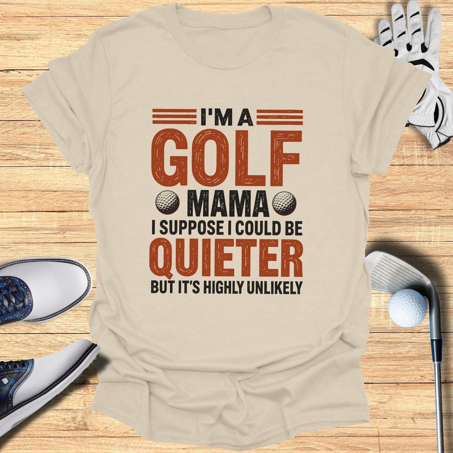 Beige t-shirt with "I'm a golf mama I suppose I could be quieter but it's highly unlikely" text.