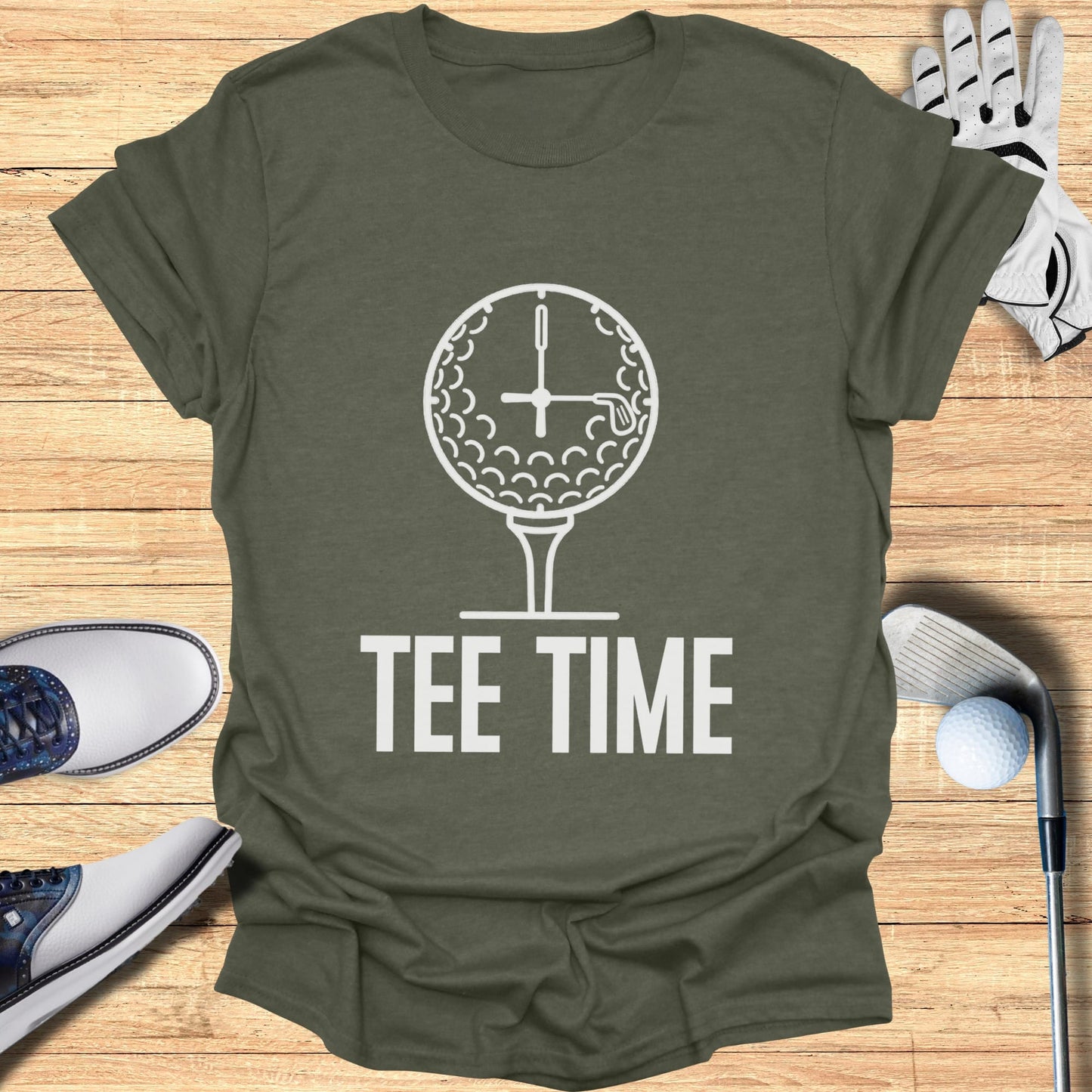 Golf ball clock and tee with "TEE TIME" text on olive green t-shirt.