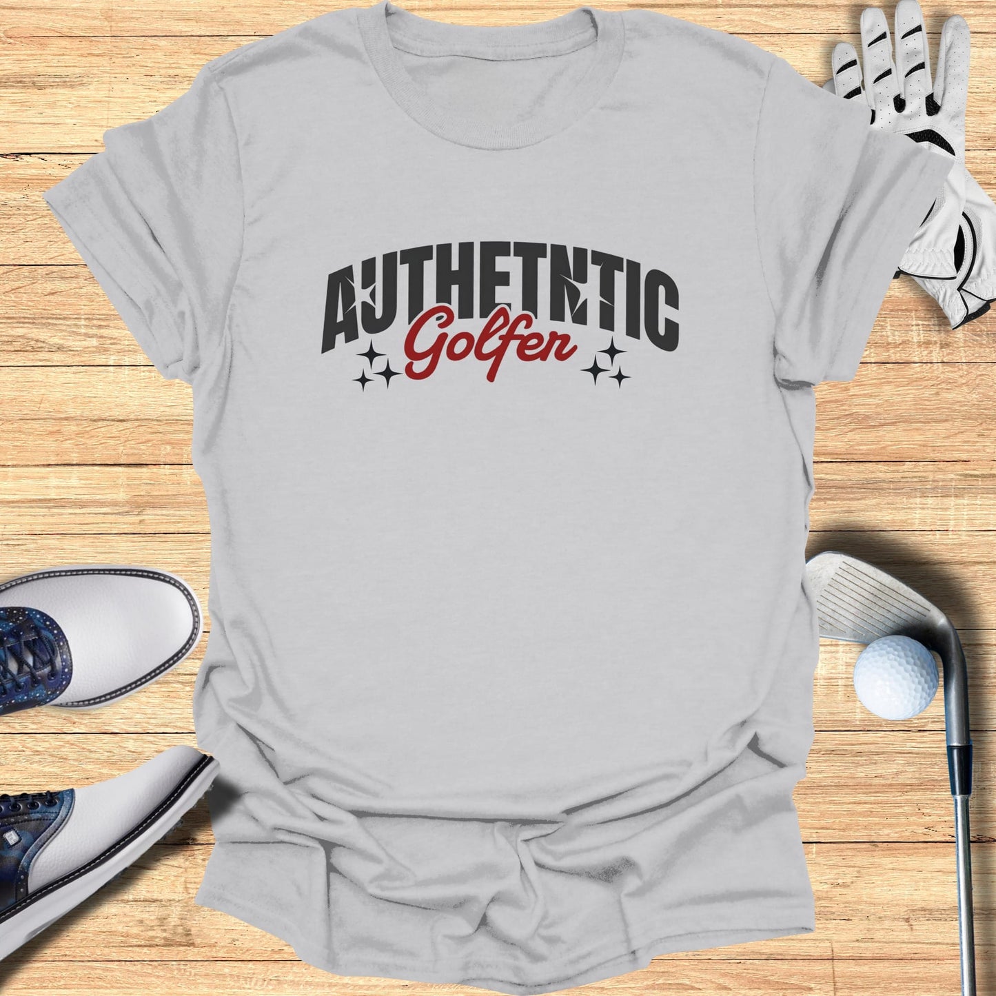 Gray t-shirt with "Authentic Golfer" text and golf accessories.