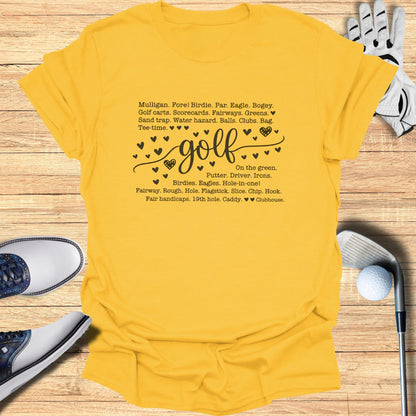 Yellow t-shirt with "golf" design and golf-themed phrases.