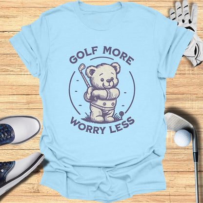 Light blue t-shirt with a cartoon teddy bear holding a golf club.