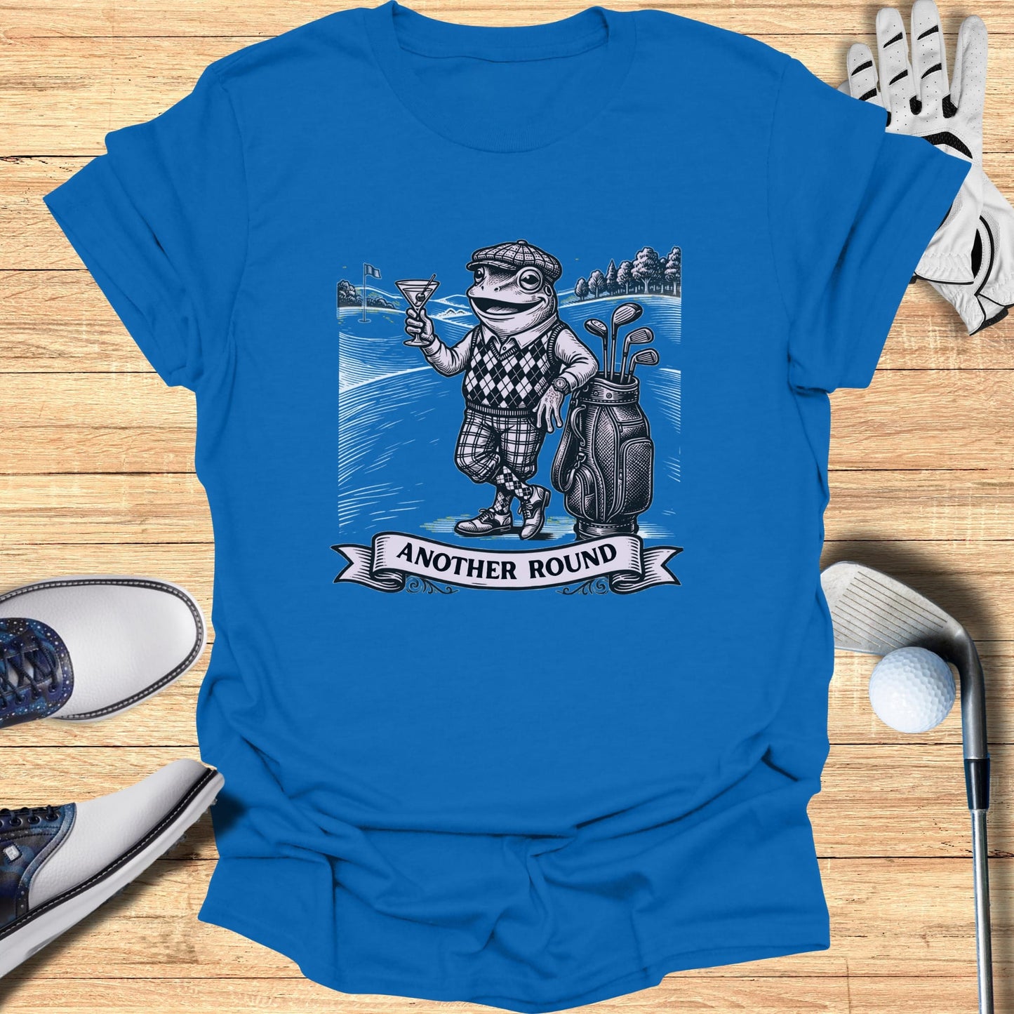 Frog in golf attire with golf bag and martini, text "Another Round".