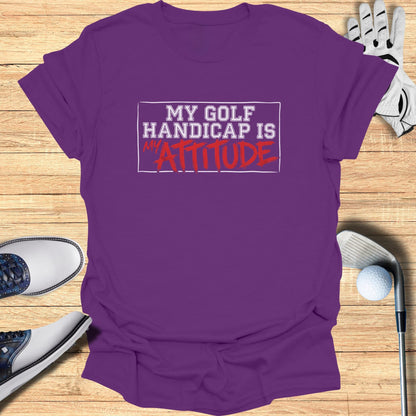 Purple t-shirt with "My Golf Handicap Is Attitude" text.