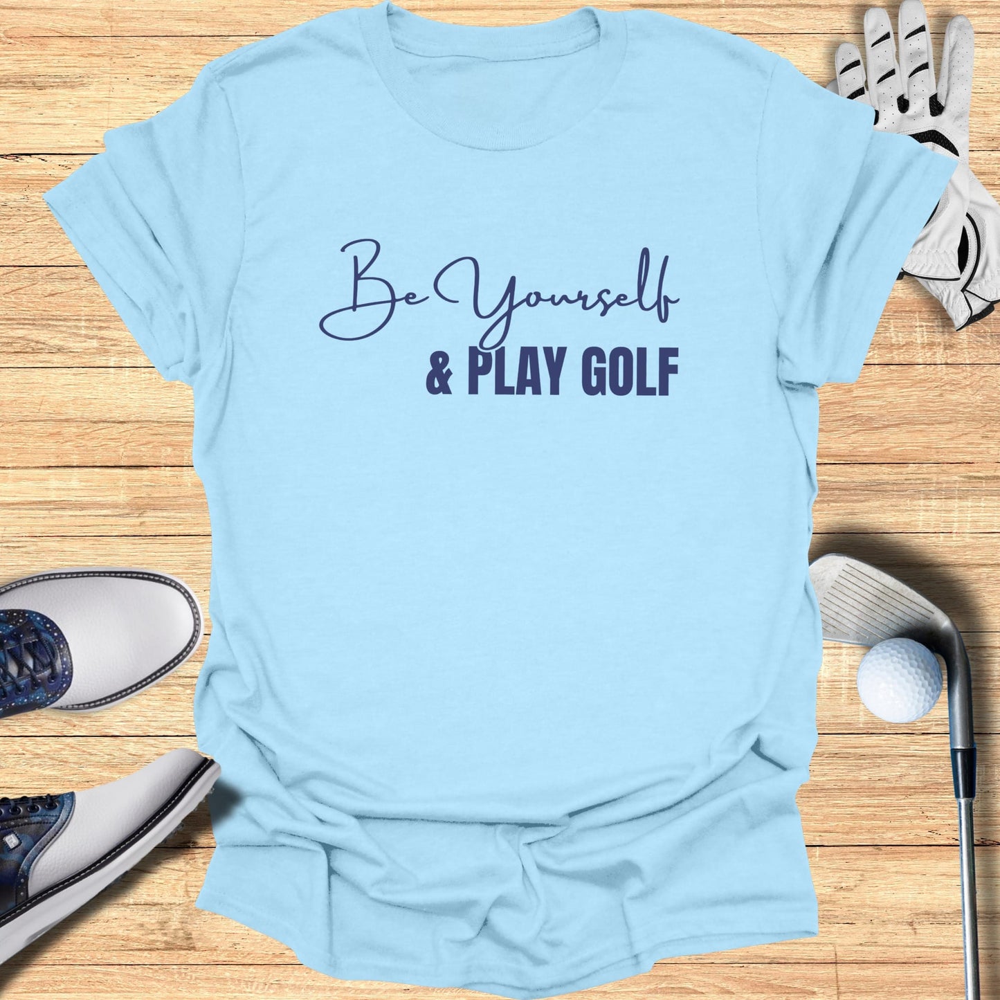 Light blue t-shirt with "Be Yourself & Play Golf" text.