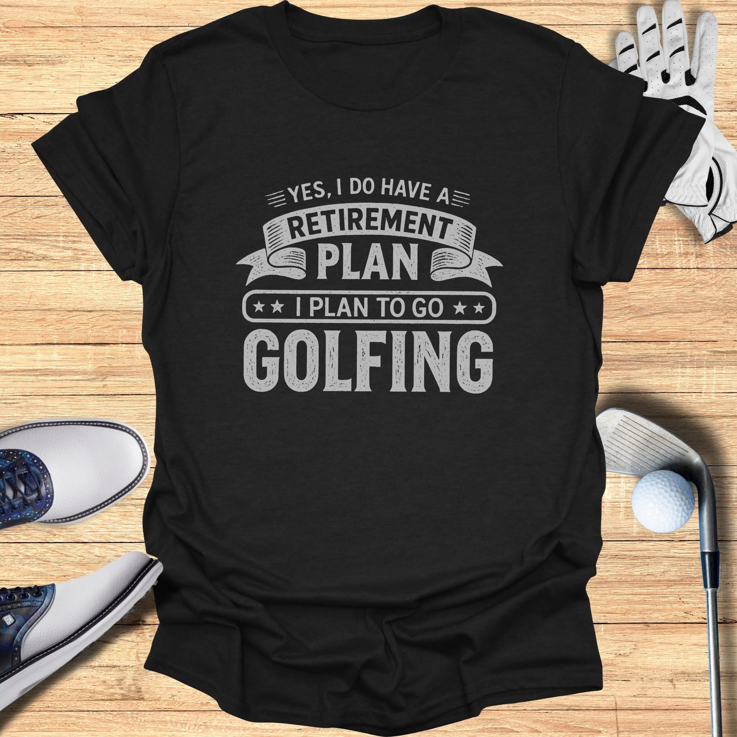Black t-shirt with text "YES, I DO HAVE A RETIREMENT PLAN I PLAN TO GO GOLFING".