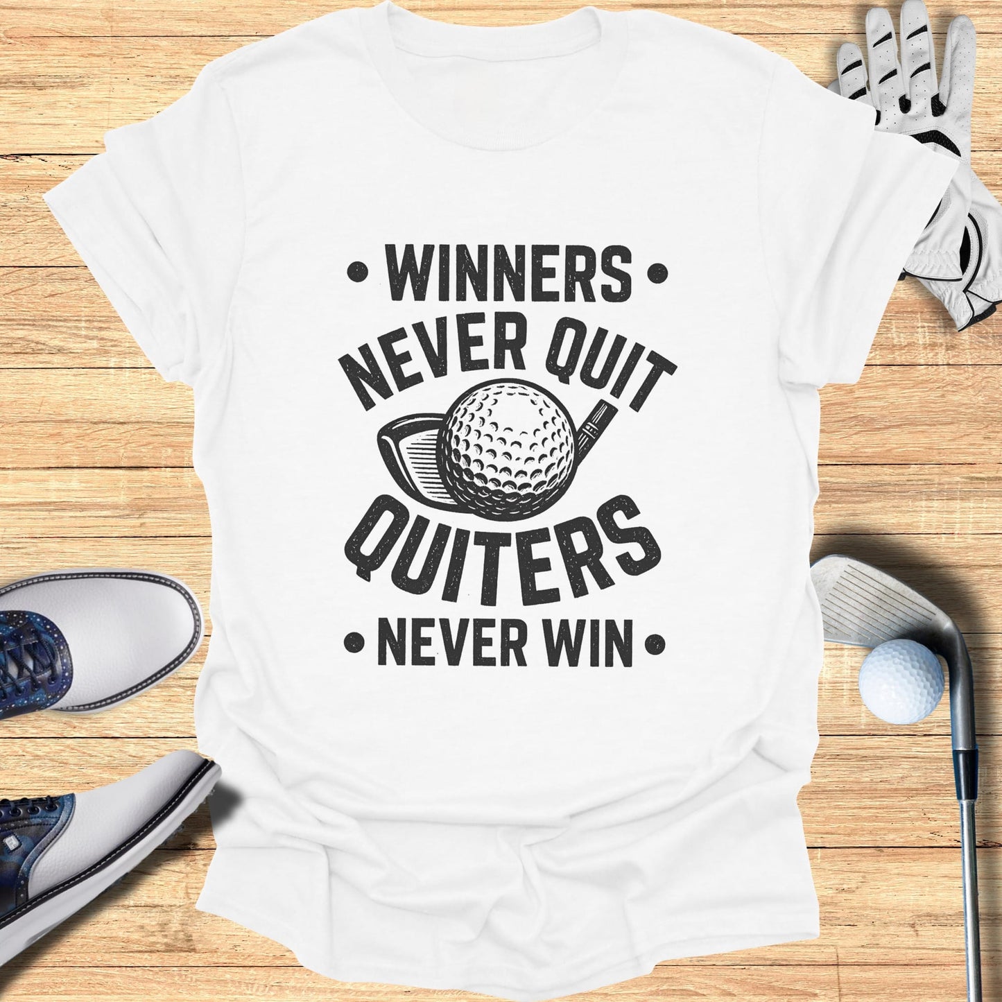 White t-shirt with "Winners Never Quit, Quitters Never Win" and golf imagery.