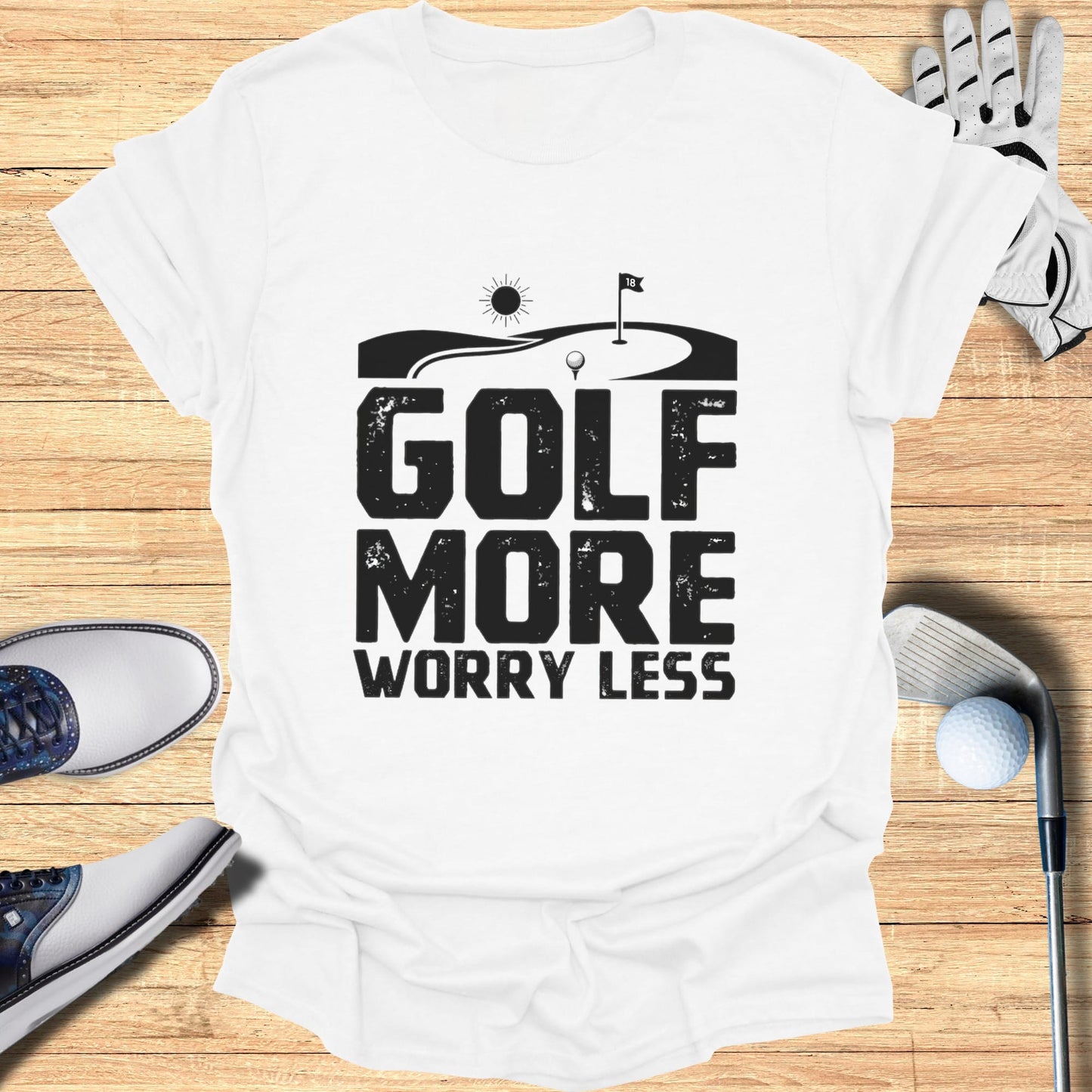 White t-shirt with "GOLF MORE WORRY LESS" text and golf graphics.