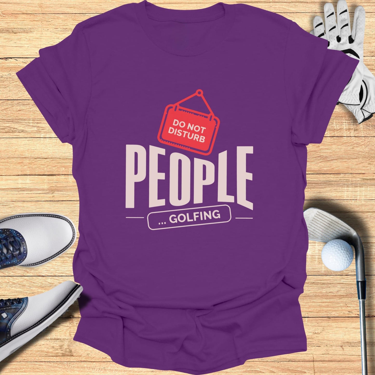 Purple t-shirt with "DO NOT DISTURB ... GOLFING" text and graphic.