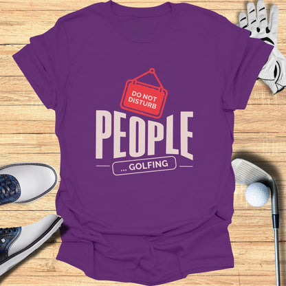 Purple t-shirt with "DO NOT DISTURB ... GOLFING" text and graphic.