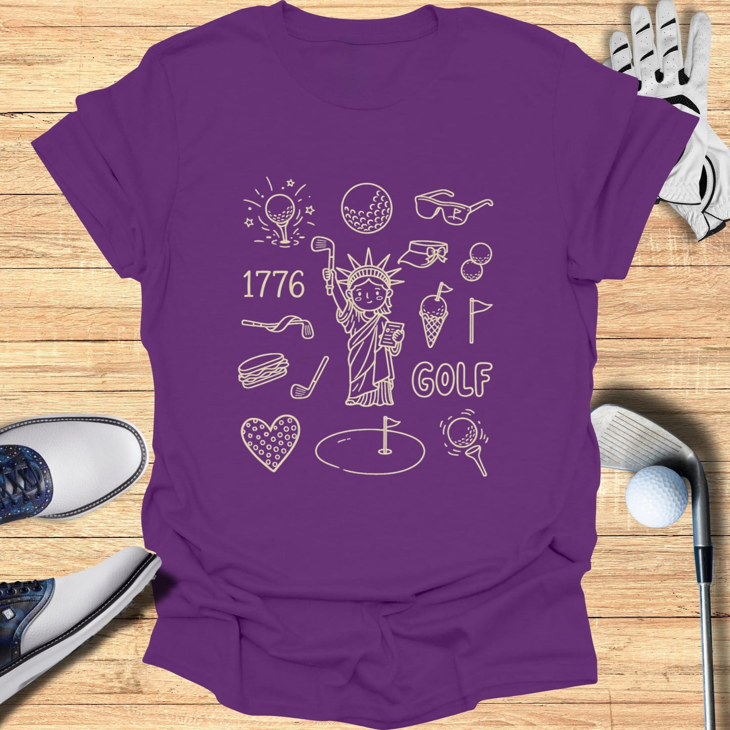 Purple t-shirt with Statue of Liberty and golf icons, "1776 GOLF".