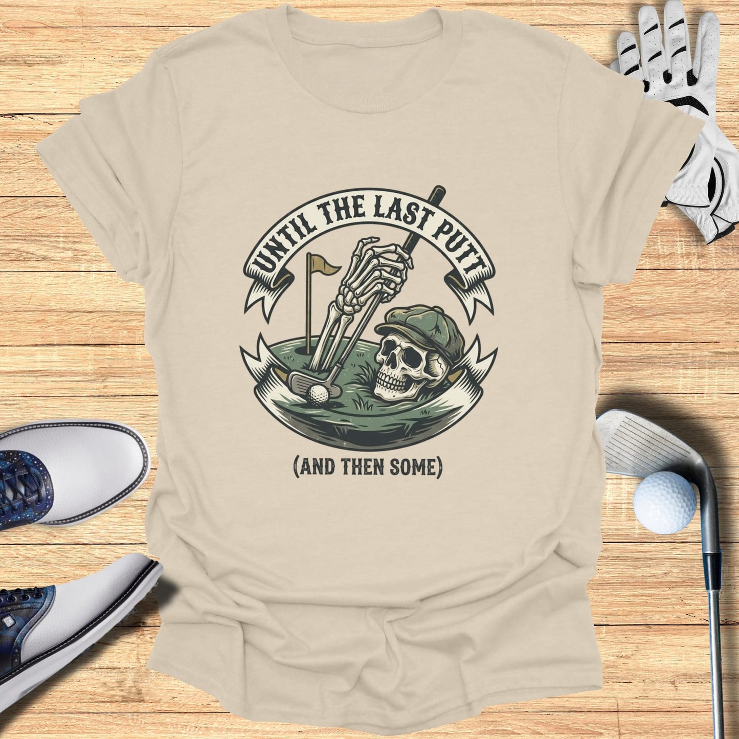 T-shirt with skull playing golf with "Until the Last Putt (and then some)" text.