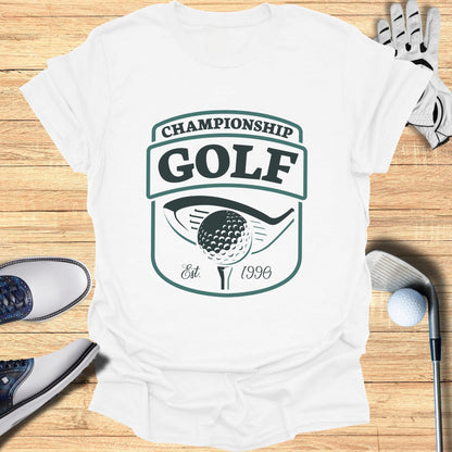 White t-shirt with "Championship Golf Est. 1990" logo.
