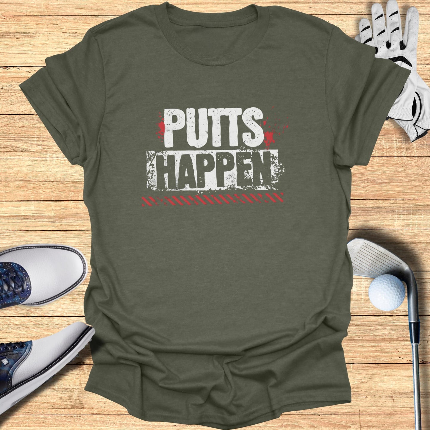 Green t-shirt with "PUTTS HAPPEN" text in white and red.