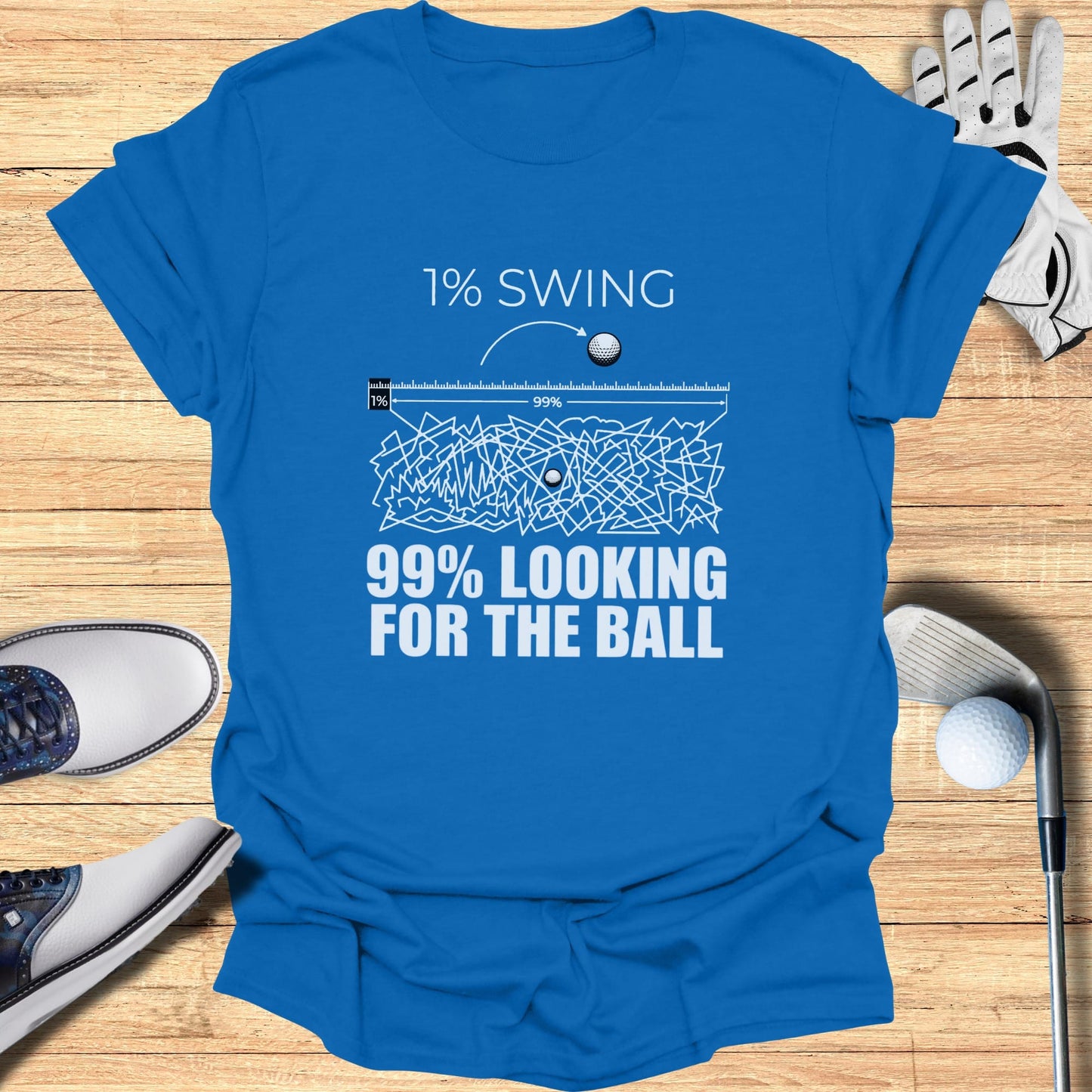 Blue t-shirt with "1% SWING 99% LOOKING FOR THE BALL" text and golf elements.