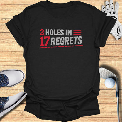 Black t-shirt with red and white text "3 HOLES IN 17 REGRETS".
