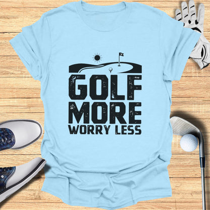 Light blue t-shirt with bold black text "GOLF MORE WORRY LESS" and a golf graphic.