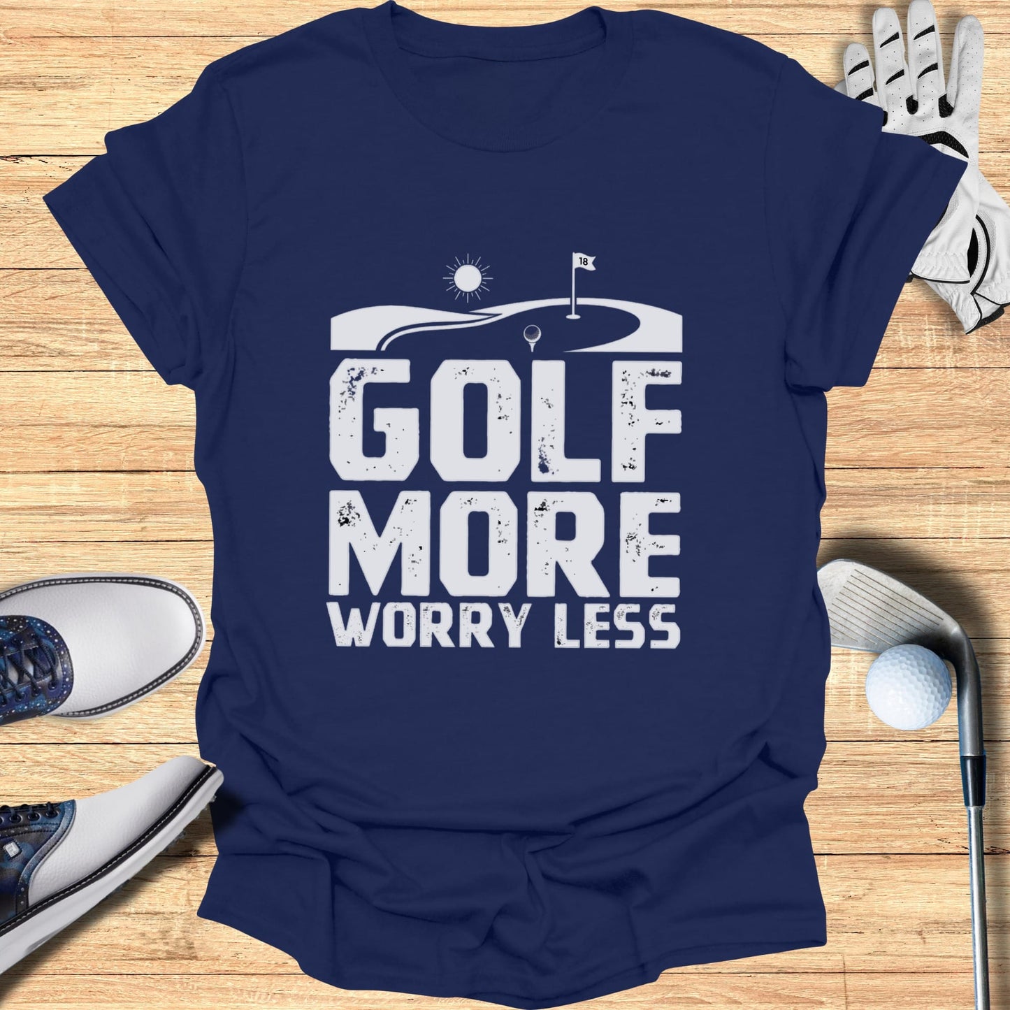 Navy t-shirt with white "GOLF MORE WORRY LESS" text and golf imagery.